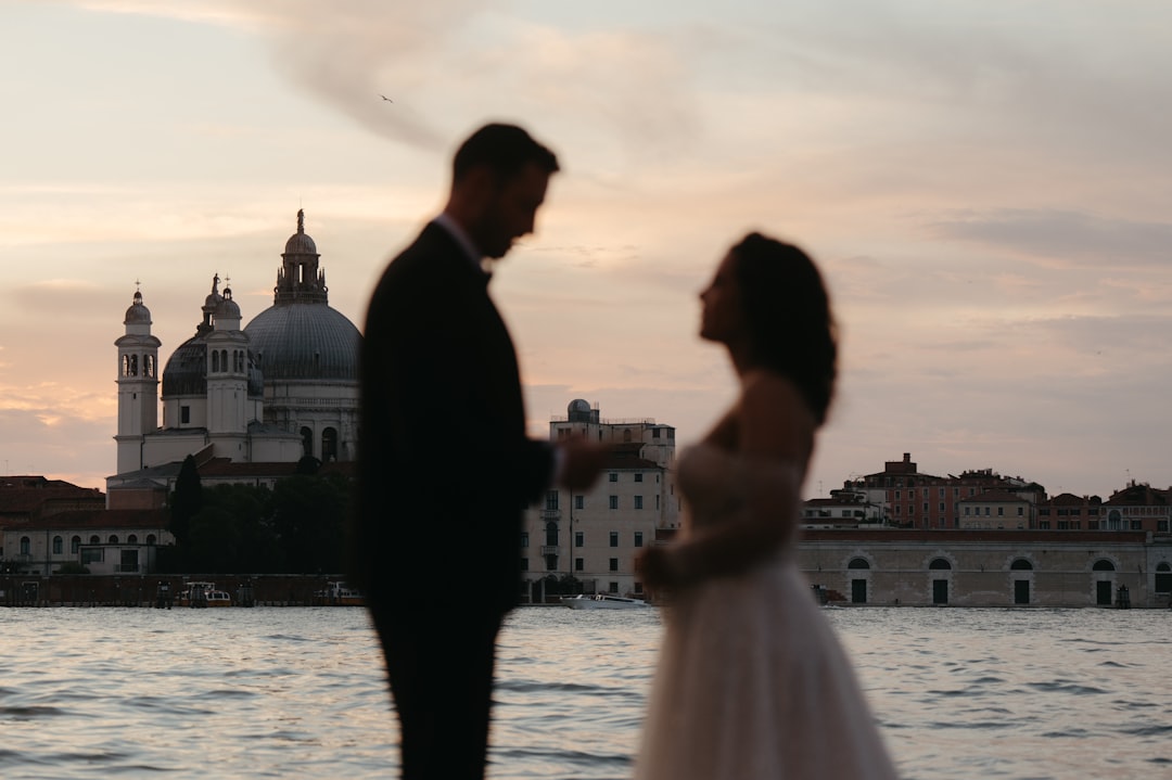 The beautiful sunset over Venice was pure romance as this couple exchanged vows during their elopement.