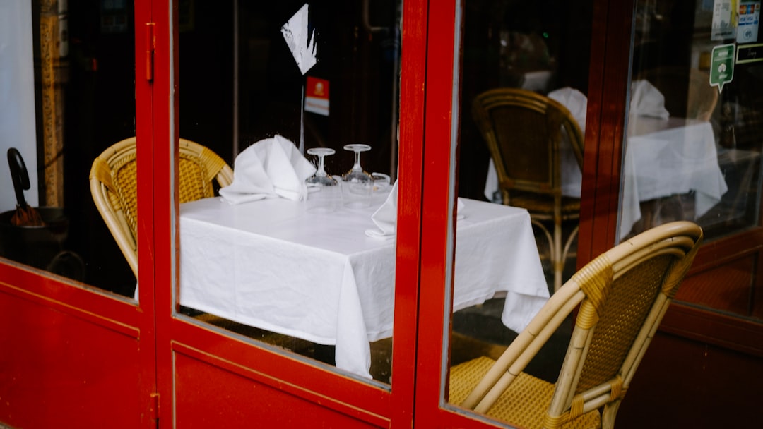 a table with two chairs and a white table cloth